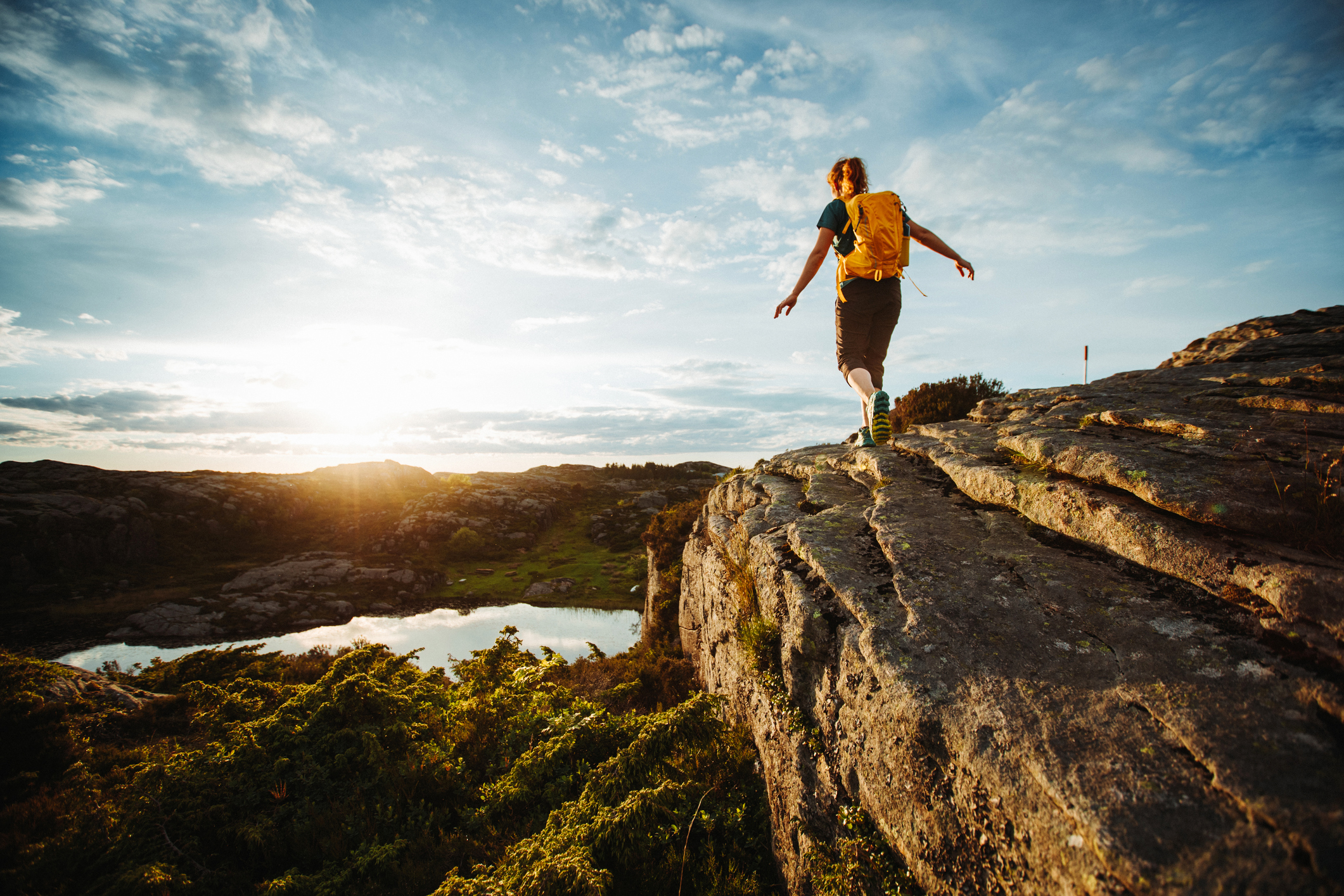 A woman is hiking in the fells.