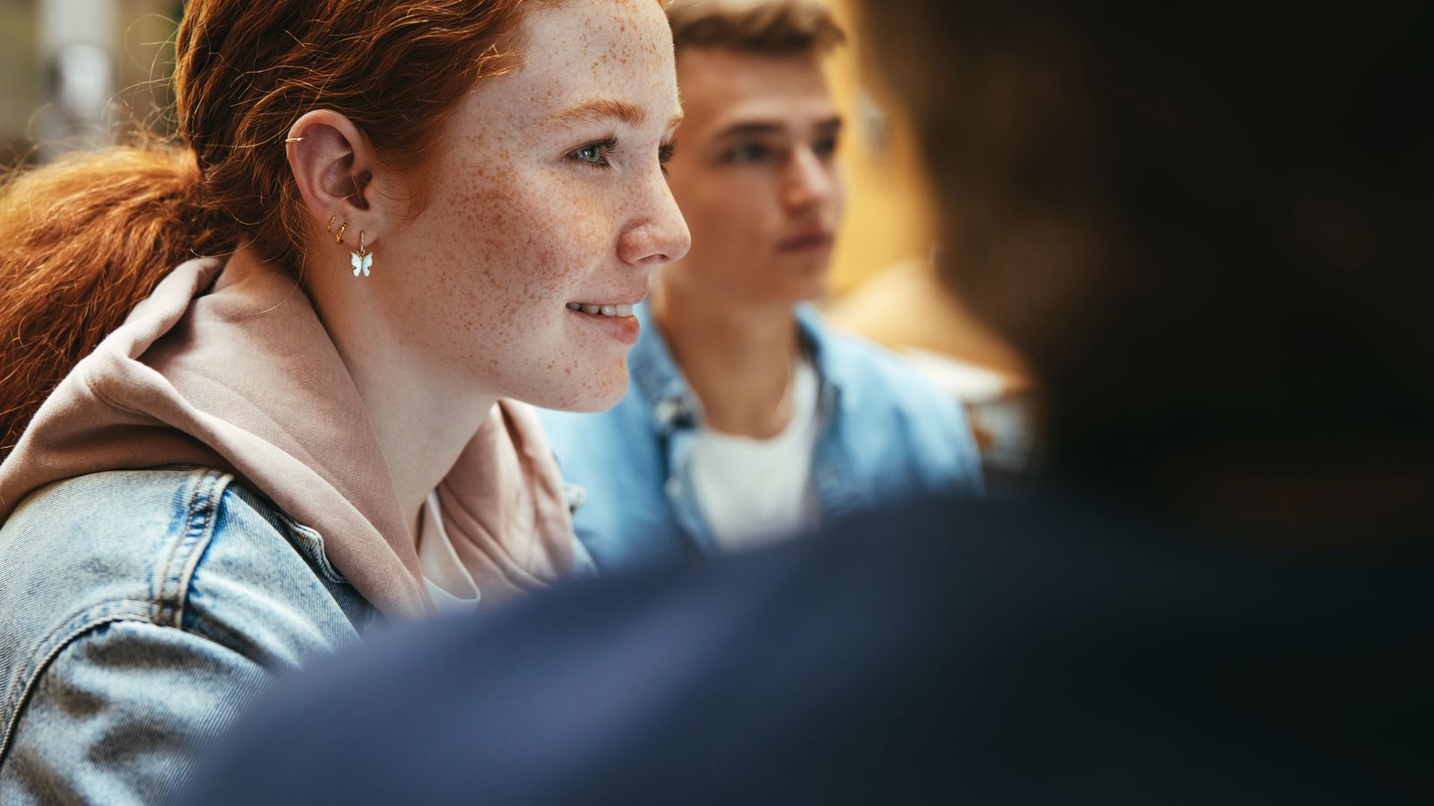The girl and the boy are looking forward.